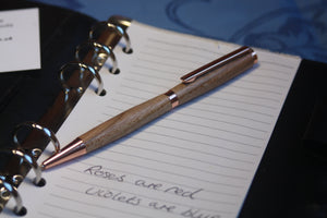 (01) - Elegant rose gold coloured twist style slimline pen